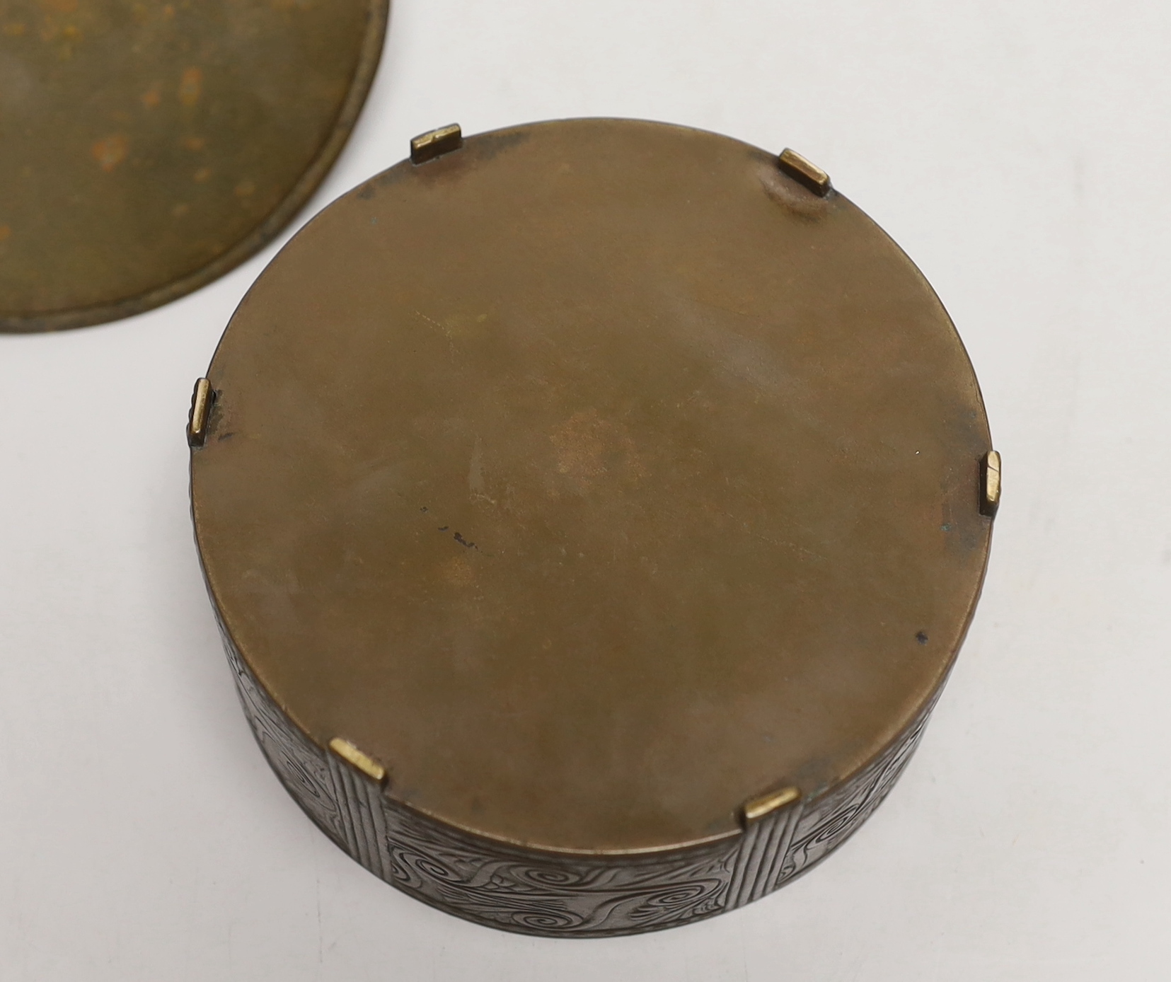 An Art Deco bronze and ivory circular box and cover, 12cm. Ivory Submission reference JQQU4ECR
